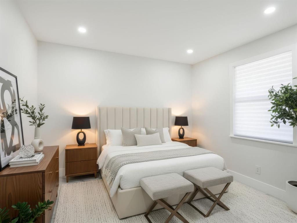 390 Hazel Circle Punta Gorda, FL 33982 - Photo 24 of 44 a bedroom with a bed and a window