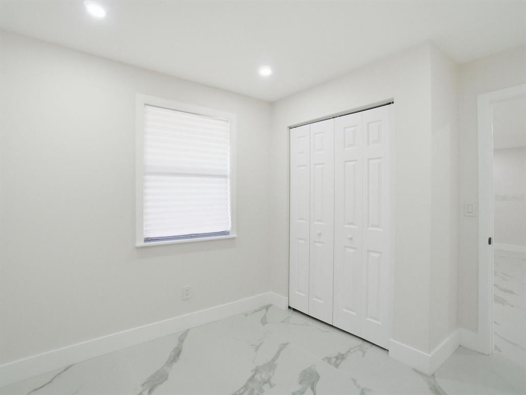 390 Hazel Circle Punta Gorda, FL 33982 - Photo 26 of 44 an empty room with windows