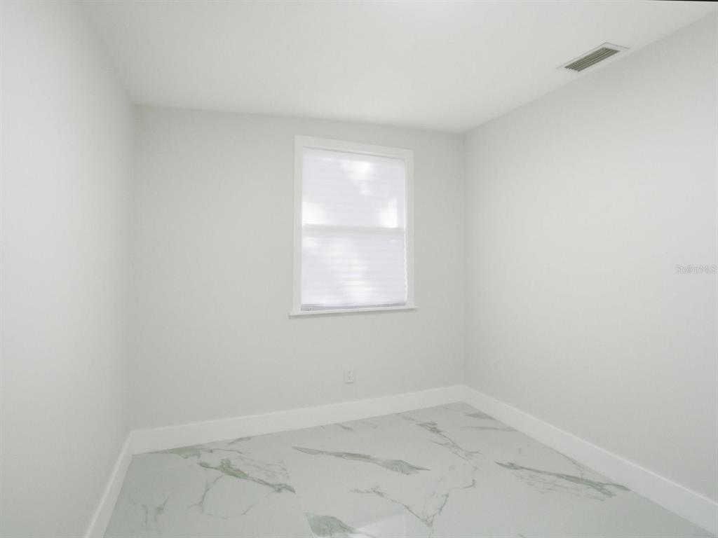 390 Hazel Circle Punta Gorda, FL 33982 - Photo 28 of 44 an empty room with a window