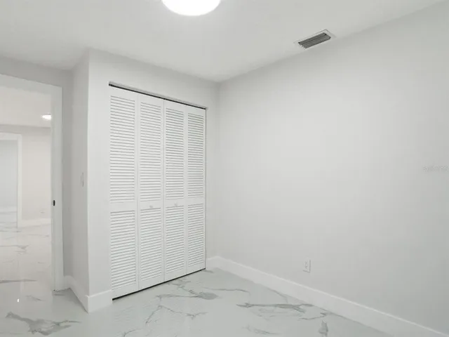a view of a dining room with furniture and window