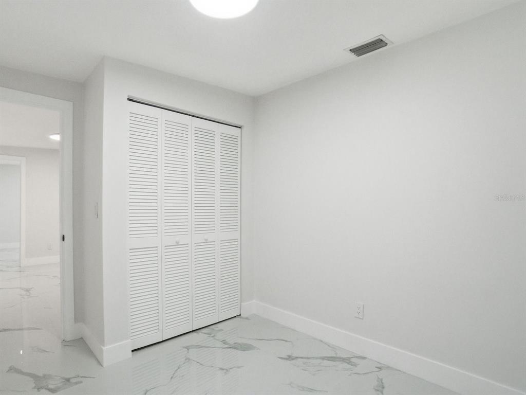 390 Hazel Circle Punta Gorda, FL 33982 - Photo 35 of 44 an empty room with windows