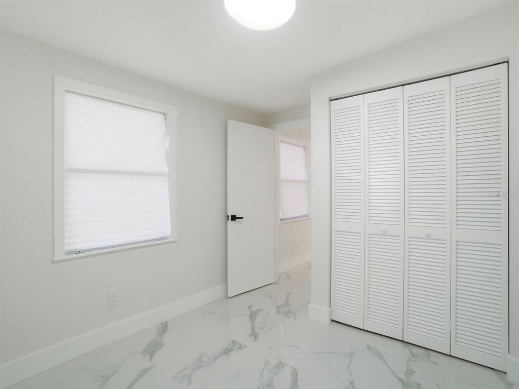 390 Hazel Circle Punta Gorda, FL 33982 - Photo 36 of 44 a view of an empty room with a window