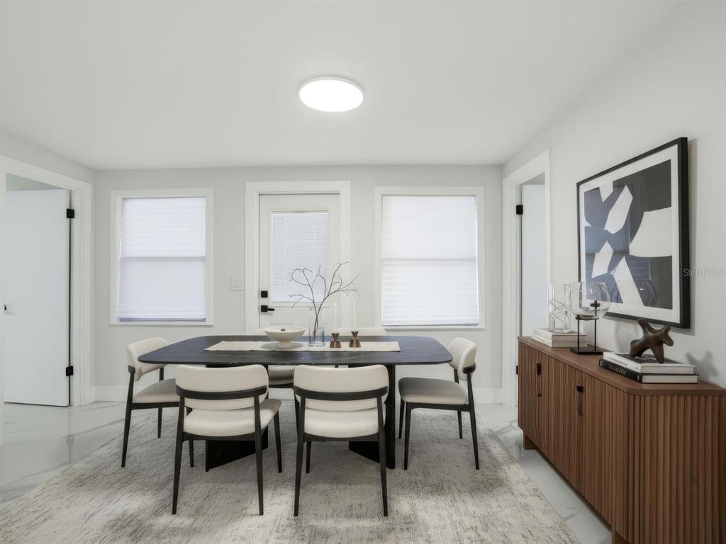390 Hazel Circle Punta Gorda, FL 33982 - Photo 37 of 44 a view of a dining room with furniture and window