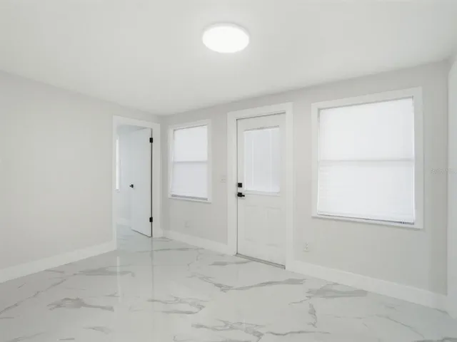 a view of a yard with a tree