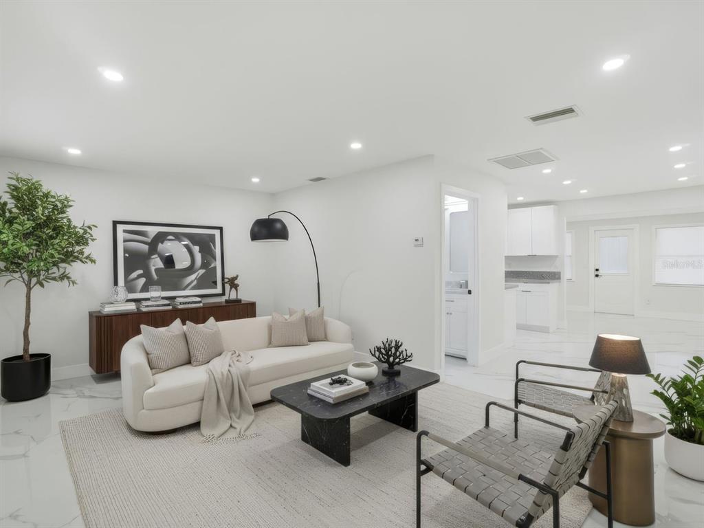 390 Hazel Circle Punta Gorda, FL 33982 - Photo 4 of 44 a living room with furniture and a potted plant
