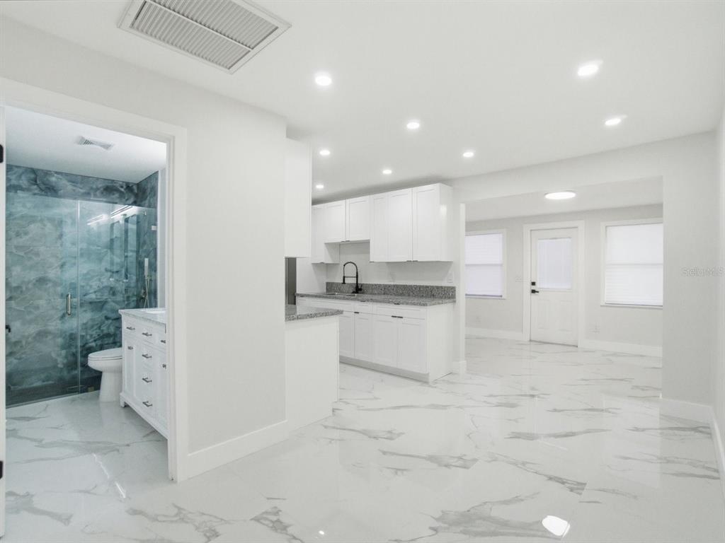 390 Hazel Circle Punta Gorda, FL 33982 - Photo 9 of 44 a view of kitchen with white cabinets