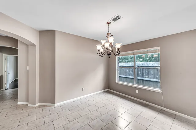 a view of an empty room with a fireplace