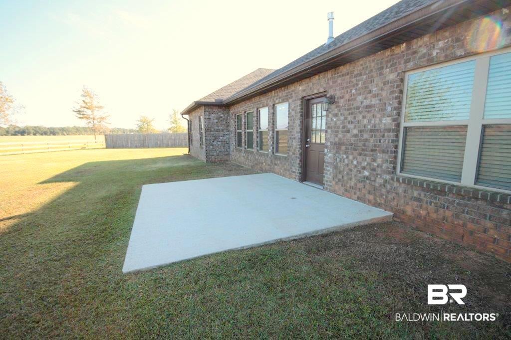 9801 Cumbria Drive Daphne, AL 36526 - Photo 32 of 41 Back of Home and Patio