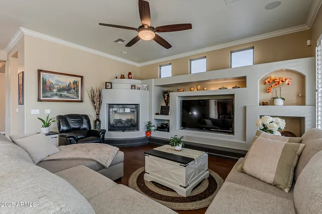 a living room with furniture pool table and a window