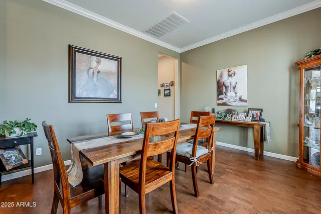 a living room with furniture and a ceiling fan