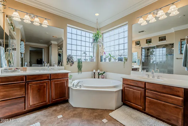 a view of a dining room with furniture and a chandelier