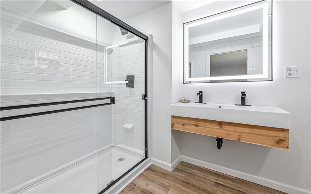2559 Nicholson Road Sewickley, PA 15143 - Photo 15 of 24 Brand new in suite bathroom on primary bedroom with large step in shower and double bowl sink.