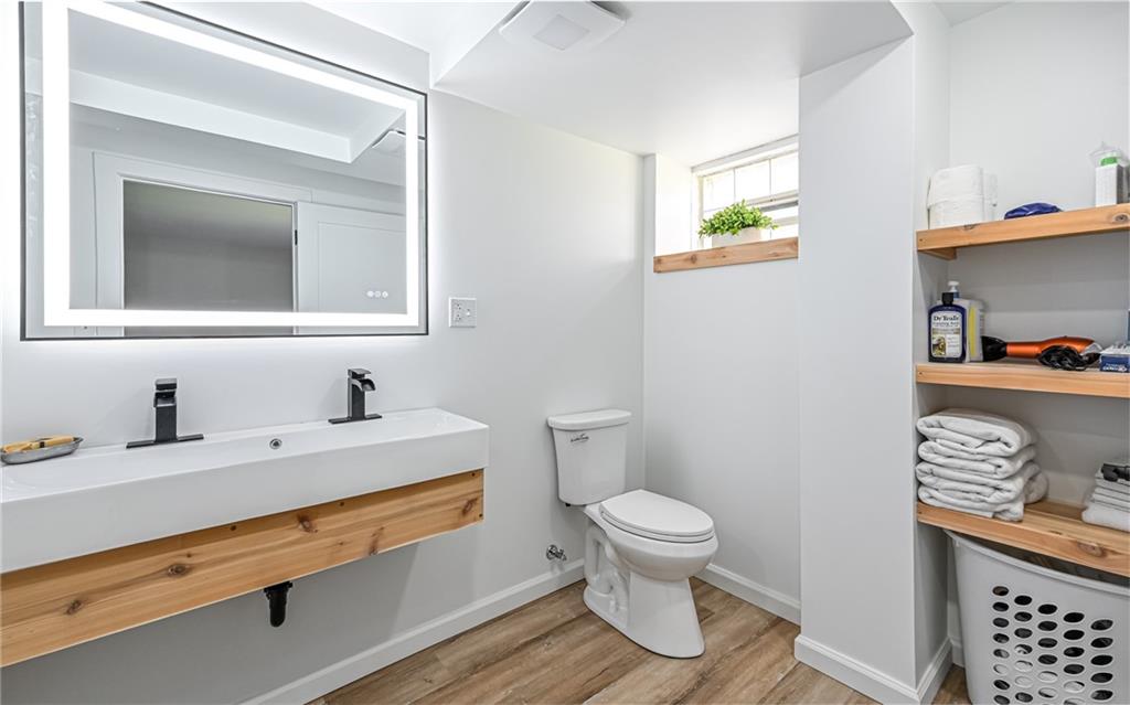2559 Nicholson Road Sewickley, PA 15143 - Photo 16 of 24 Easy to maintain wood look vinyl flooring with shelving for linens and touch lighted mirror.