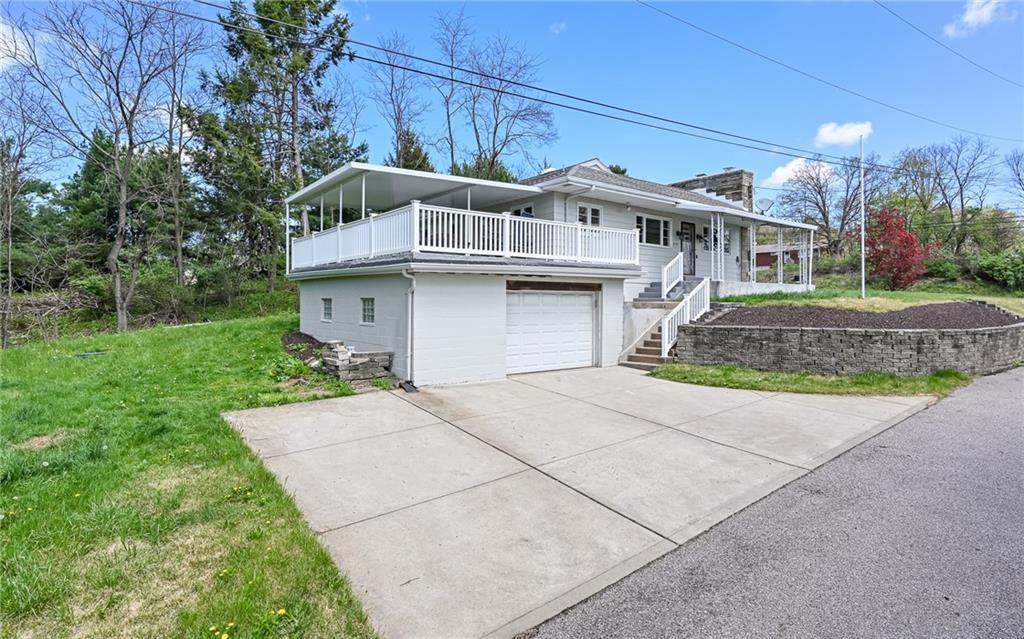 2559 Nicholson Road Sewickley, PA 15143 - Photo 18 of 24 Oversized 1 1/2 car garage with concrete driveway that will fit at least 3 cars is perfect for workshop, storage, etc.