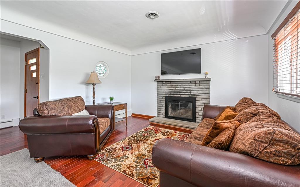 2559 Nicholson Road Sewickley, PA 15143 - Photo 4 of 24 Living room with cozy stacked stone wood burning fireplace.