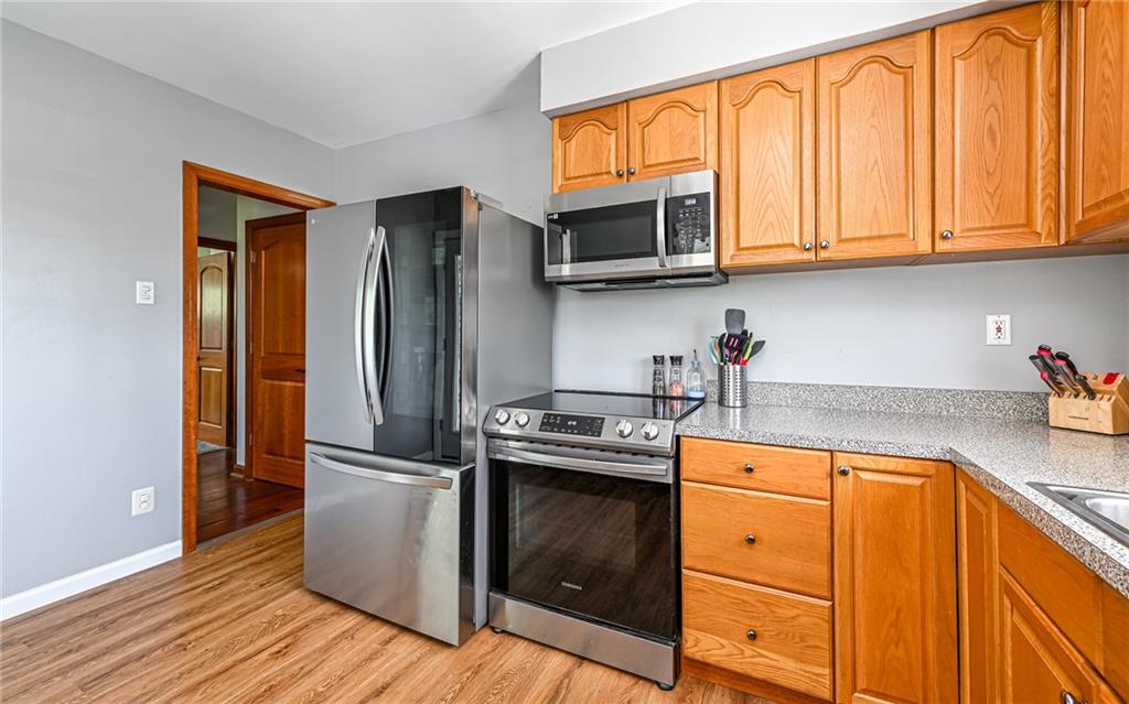 2559 Nicholson Road Sewickley, PA 15143 - Photo 7 of 24 Kitchen is fully equipped with stainless appliances featuring Instaview glass panel door refrigerator, electric range with over the range microwave and dishwasher.
