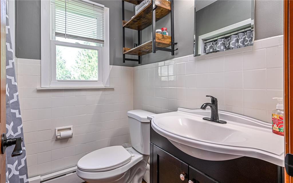 2559 Nicholson Road Sewickley, PA 15143 - Photo 10 of 24 Updated first floor main level full bathroom with bathtub and shower.