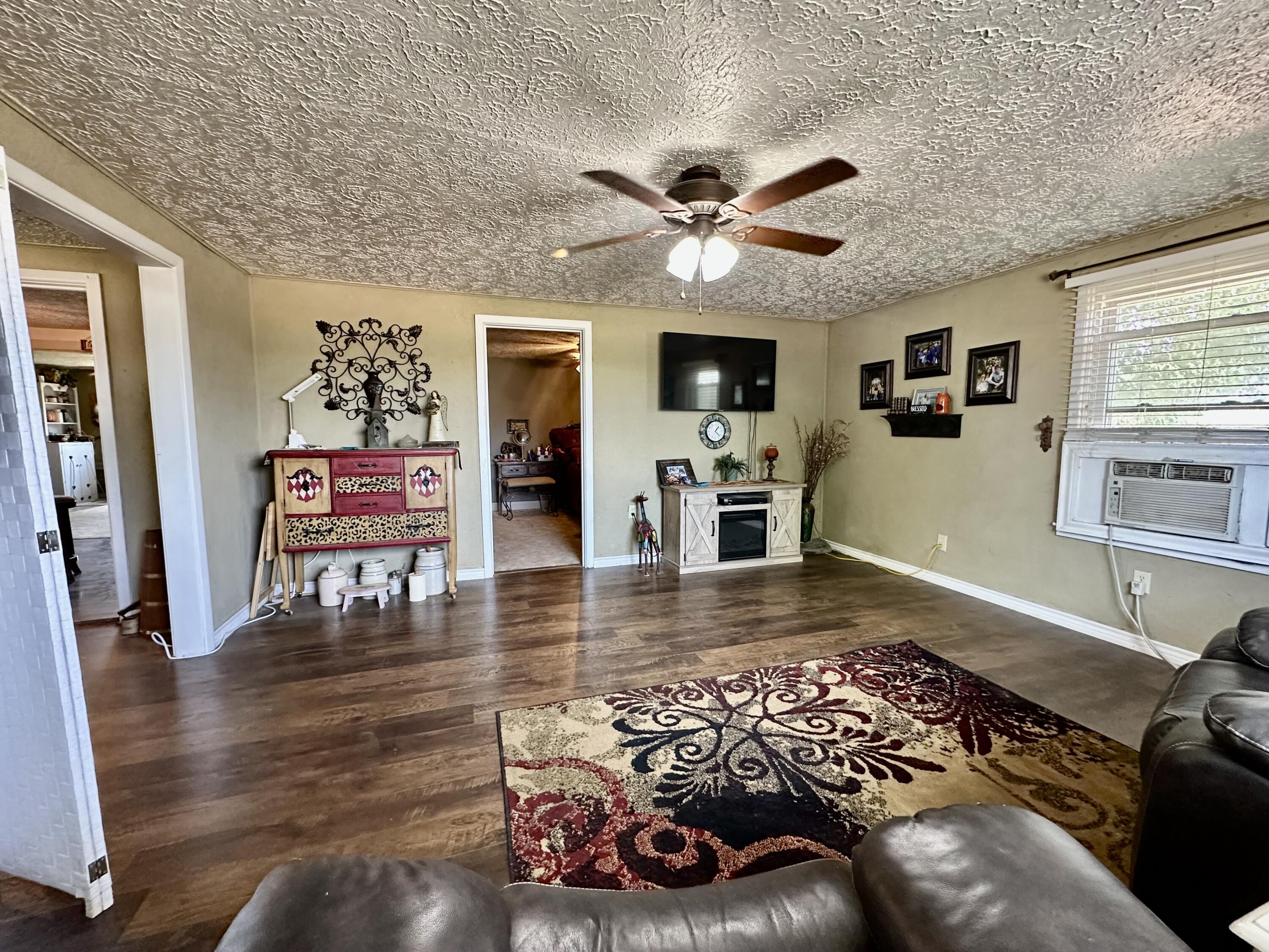 600 Mulberry Street Turkey, TX 79261 - Photo 11 of 29 a living room with furniture and a flat screen tv
