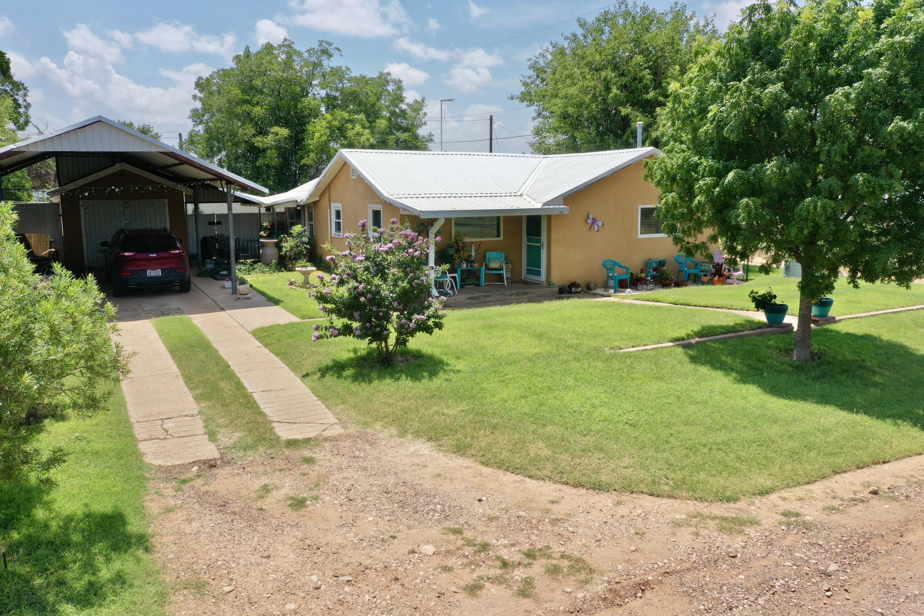 600 Mulberry Street Turkey, TX 79261 - Photo 2 of 29 a front view of a house with garden