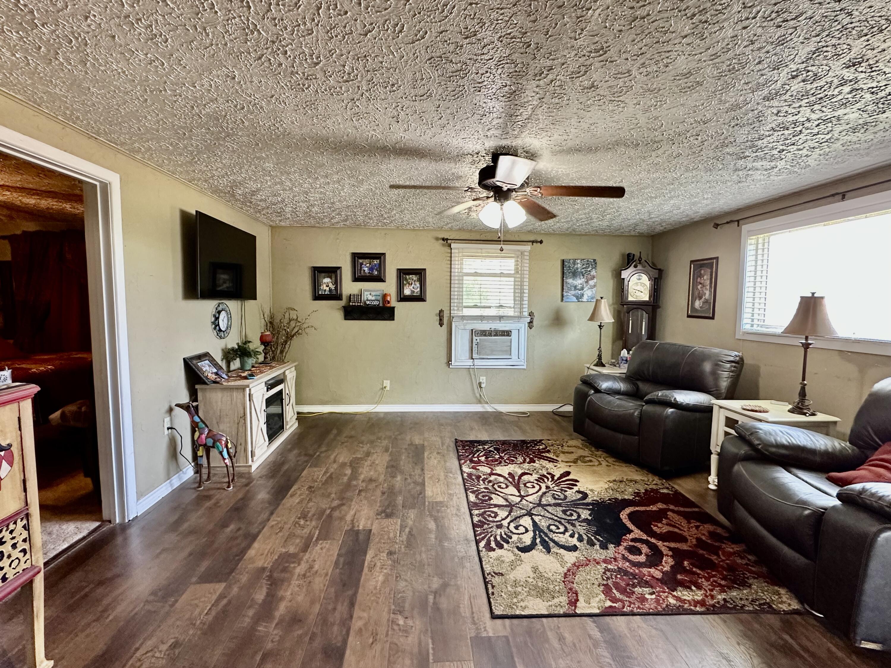 600 Mulberry Street Turkey, TX 79261 - Photo 23 of 29 a living room with furniture and a flat screen tv
