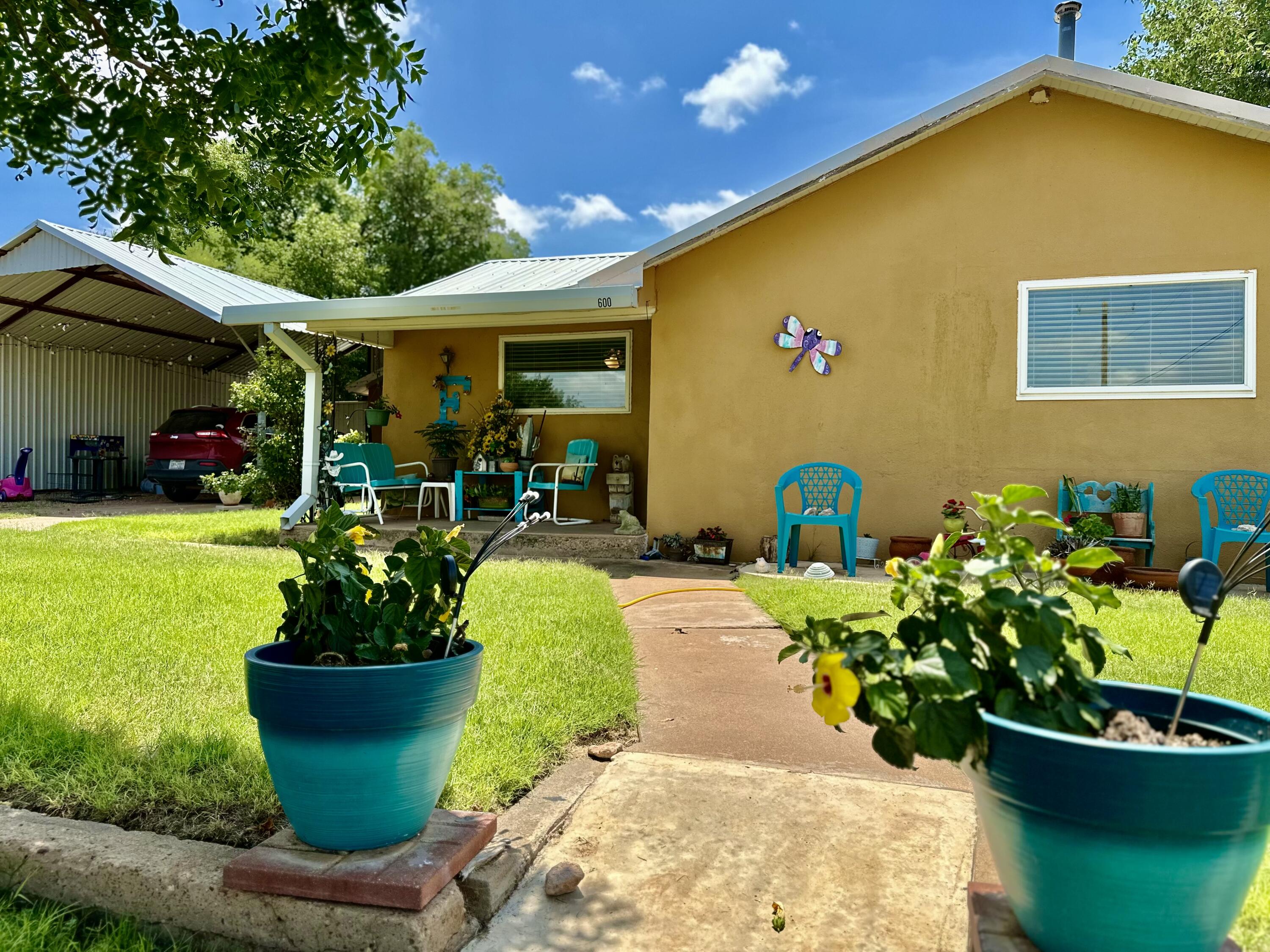 600 Mulberry Street Turkey, TX 79261 - Photo 28 of 29 a front view of a house with garden