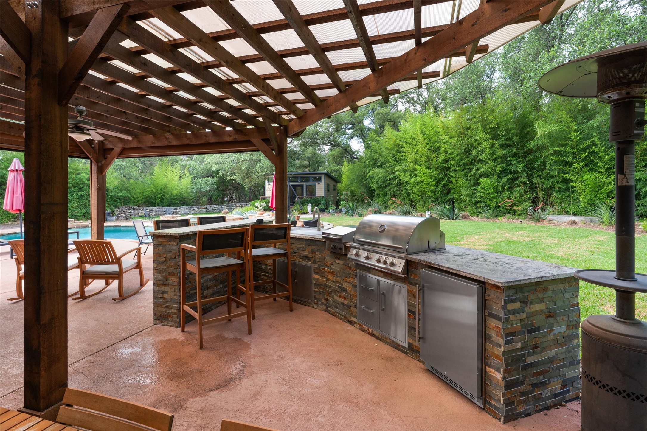 223 East Ridgewood Road Georgetown, TX 78633 - Photo 26 of 40 An inviting outdoor kitchen area with a built-in grill