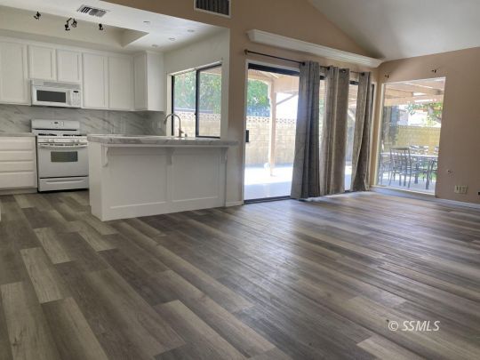 1025 Scott Street Ridgecrest, CA 93555 - Photo 10 of 29 a kitchen with stainless steel appliances granite countertop a stove a sink and a refrigerator