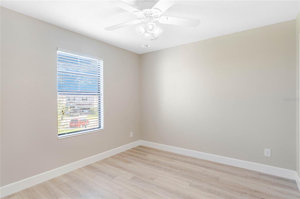 337 Partridge Pea Lane Ocoee, FL 34761 - Photo 20 of 38 wooden floor in an empty room with a window