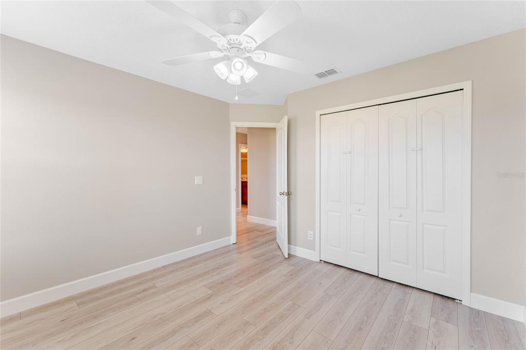 337 Partridge Pea Lane Ocoee, FL 34761 - Photo 23 of 38 an empty room with wooden floor and window