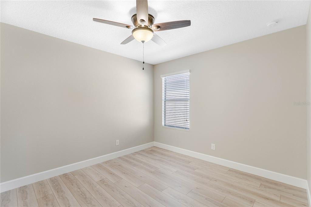 337 Partridge Pea Lane Ocoee, FL 34761 - Photo 24 of 38 an empty room with a window and a fan