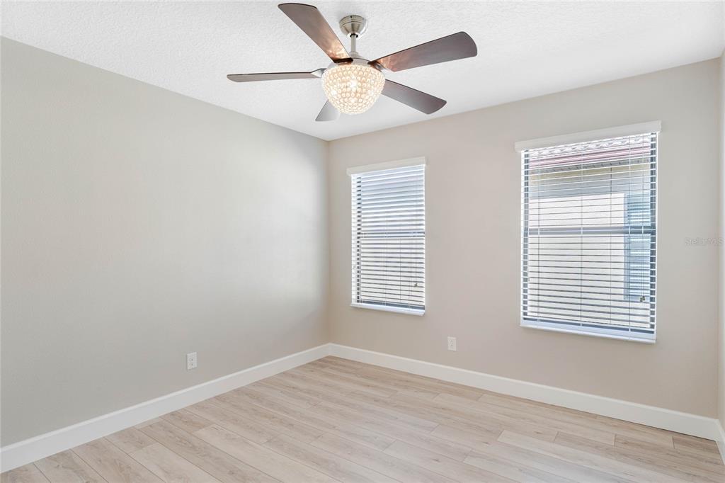 337 Partridge Pea Lane Ocoee, FL 34761 - Photo 27 of 38 a view of an empty room with wooden floor and a window