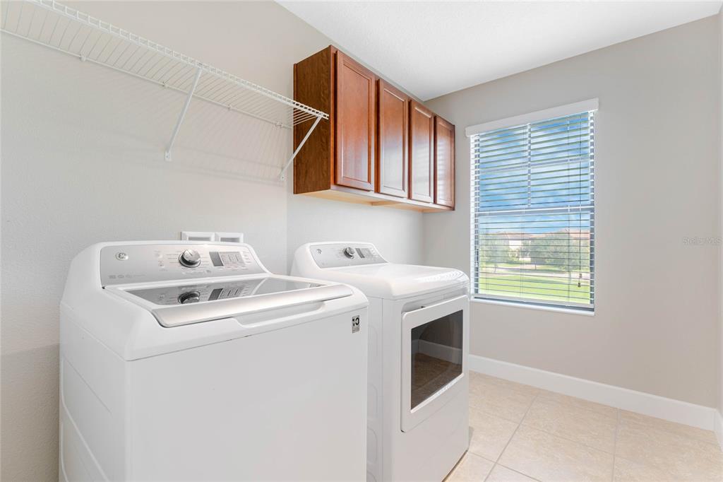 337 Partridge Pea Lane Ocoee, FL 34761 - Photo 28 of 38 a utility room with dryer and washer
