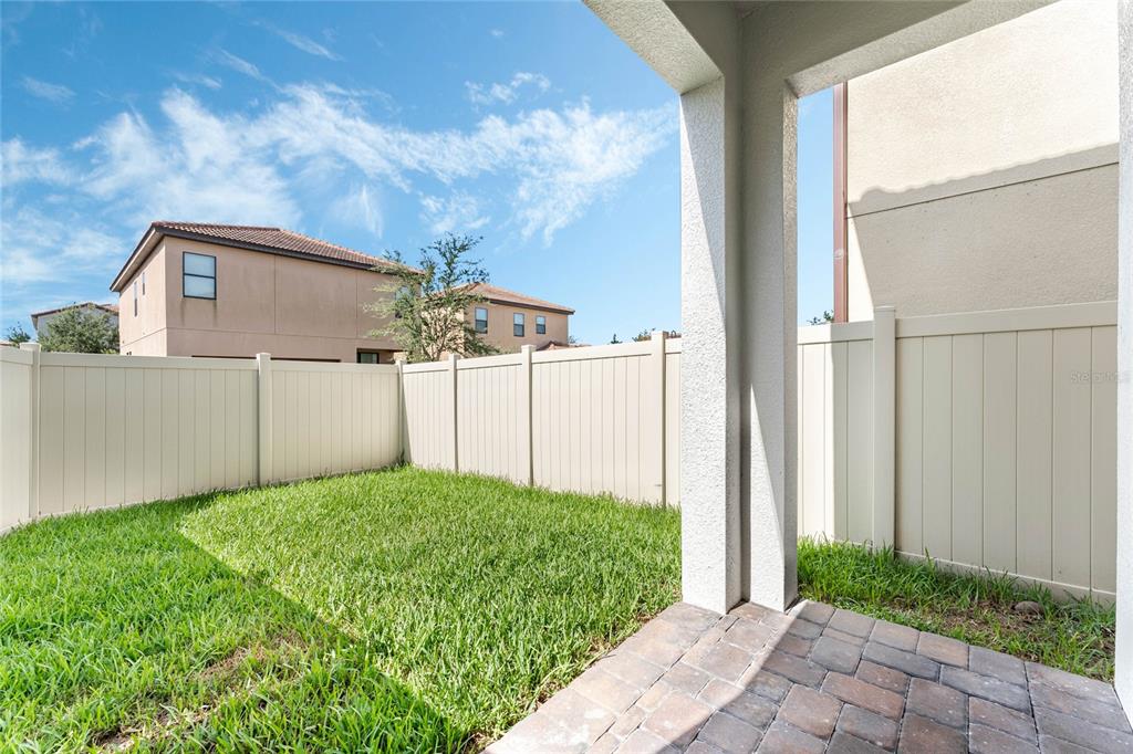 337 Partridge Pea Lane Ocoee, FL 34761 - Photo 30 of 38 a view of a house with backyard and garden