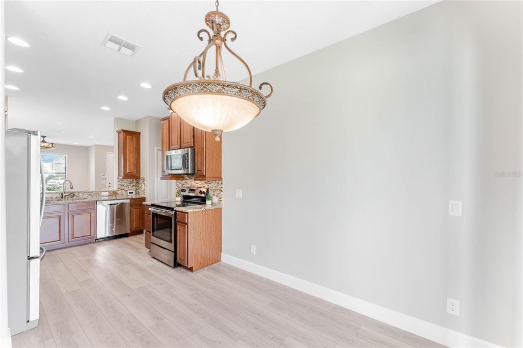 337 Partridge Pea Lane Ocoee, FL 34761 - Photo 10 of 38 a kitchen with a sink and a stove