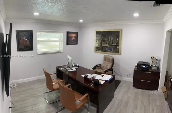 a dining room with furniture and wooden floor