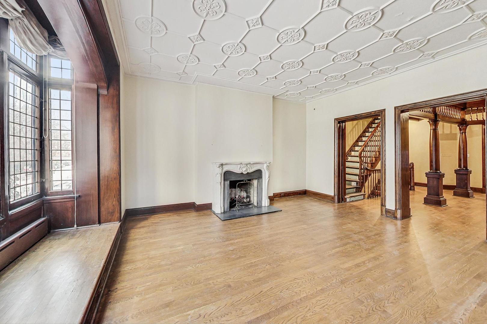1310 North Astor Street Chicago, IL 60610 - Photo 13 of 33 a view of an empty room with a fireplace