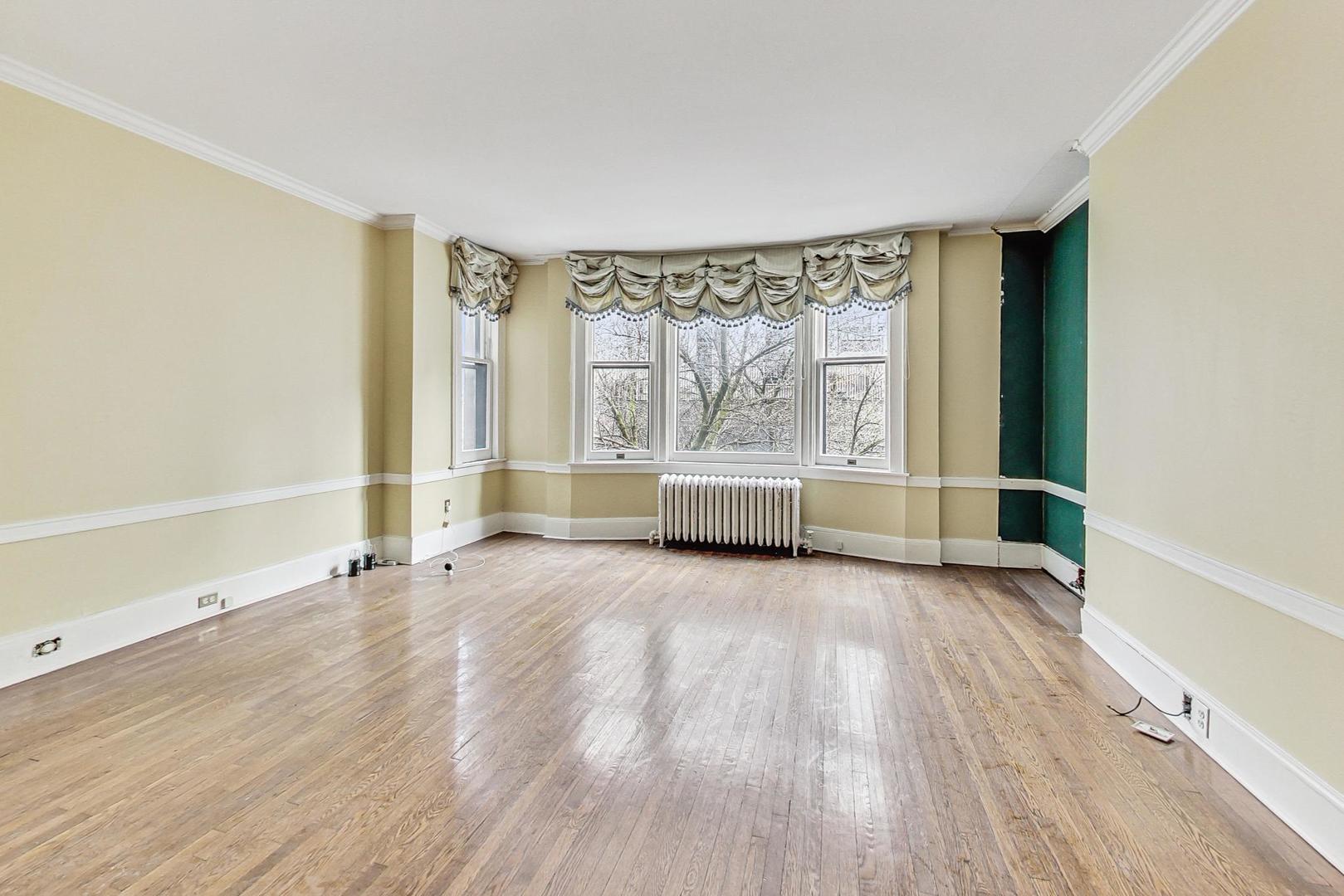 1310 North Astor Street Chicago, IL 60610 - Photo 17 of 33 wooden floor in an empty room with a window