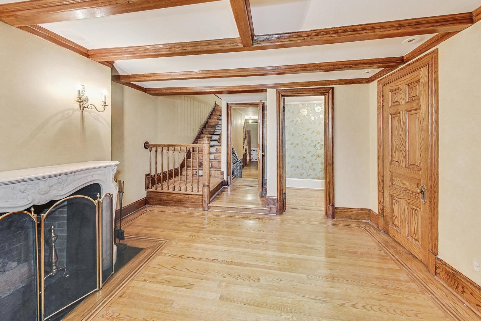 1310 North Astor Street Chicago, IL 60610 - Photo 5 of 33 a view of a hallway with wooden floor and staircase