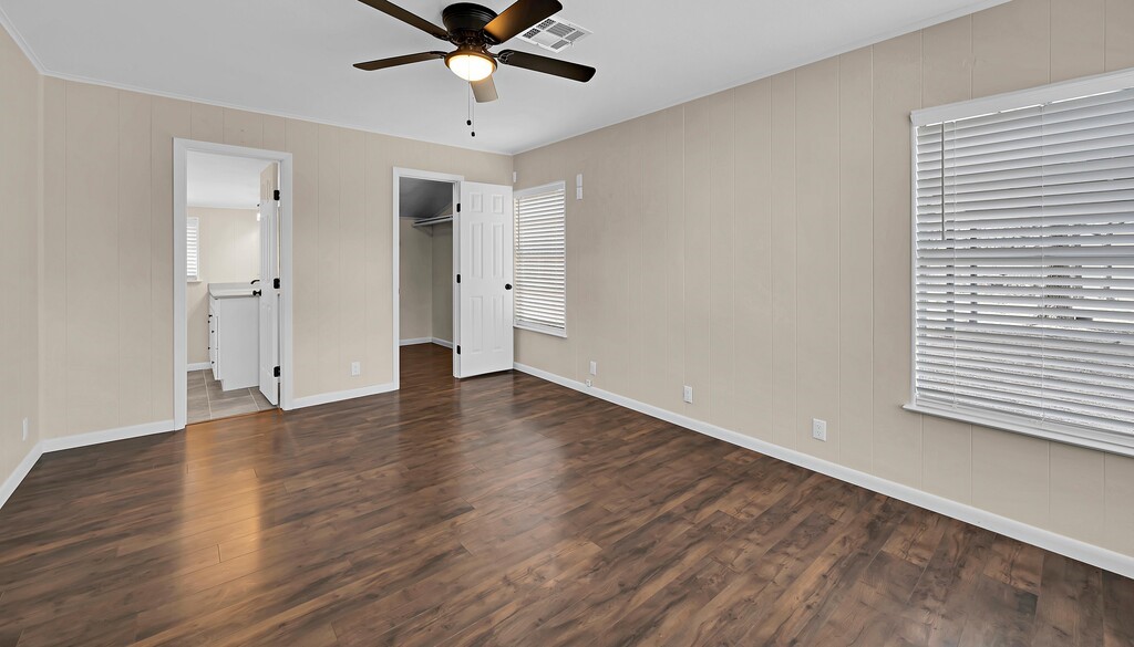 122 Teeling Trail Whitney, TX 76692 - Photo 27 of 31 a view of an empty room with wooden floor and a window