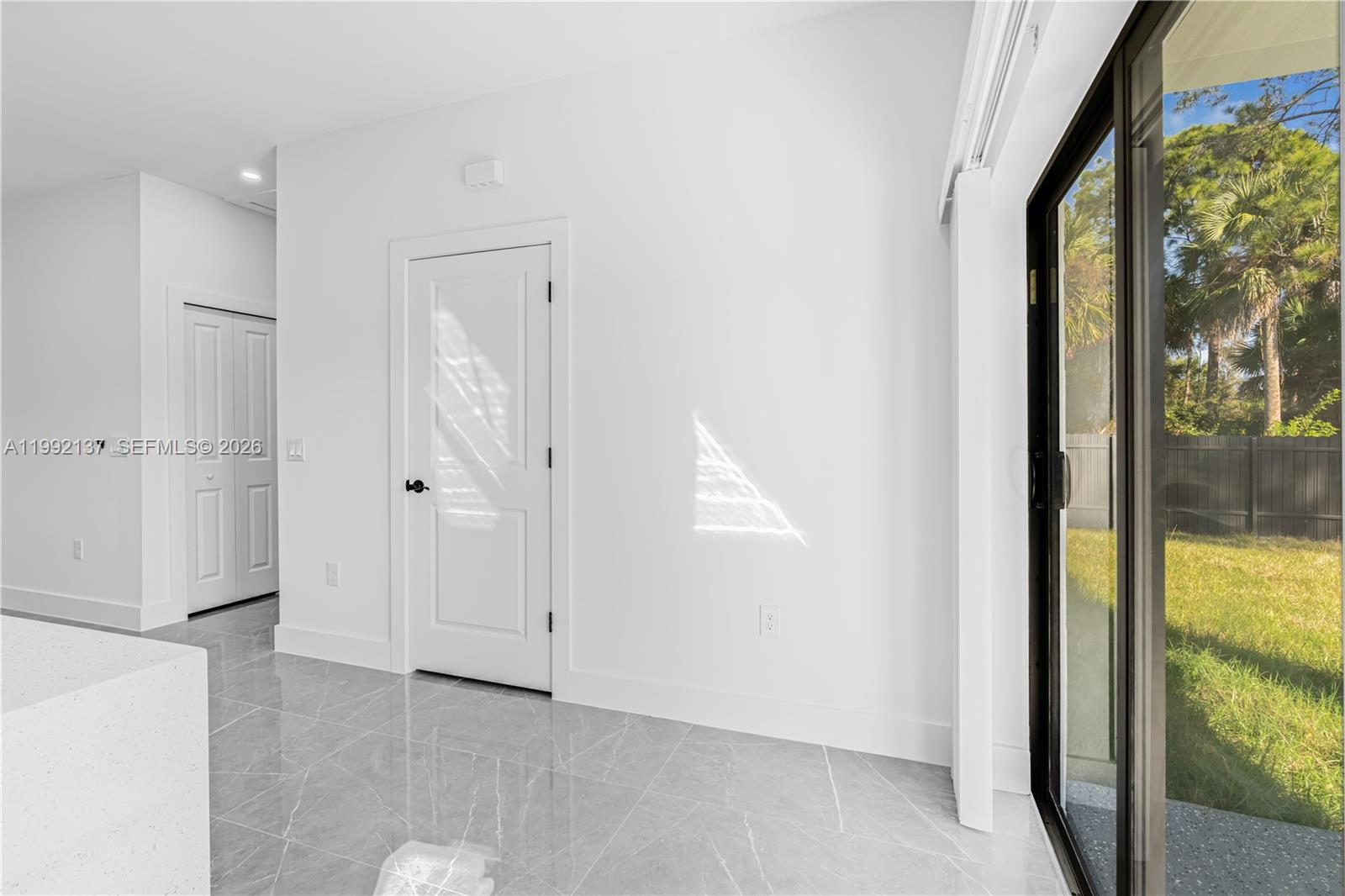 747 Roma Avenue South Lehigh Acres, FL 33974 - Photo 14 of 31 an empty room with windows and closet