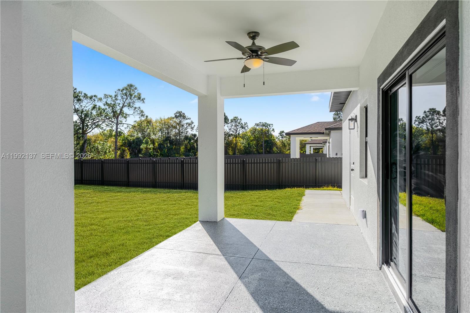 747 Roma Avenue South Lehigh Acres, FL 33974 - Photo 26 of 31 a view of a porch with a garden