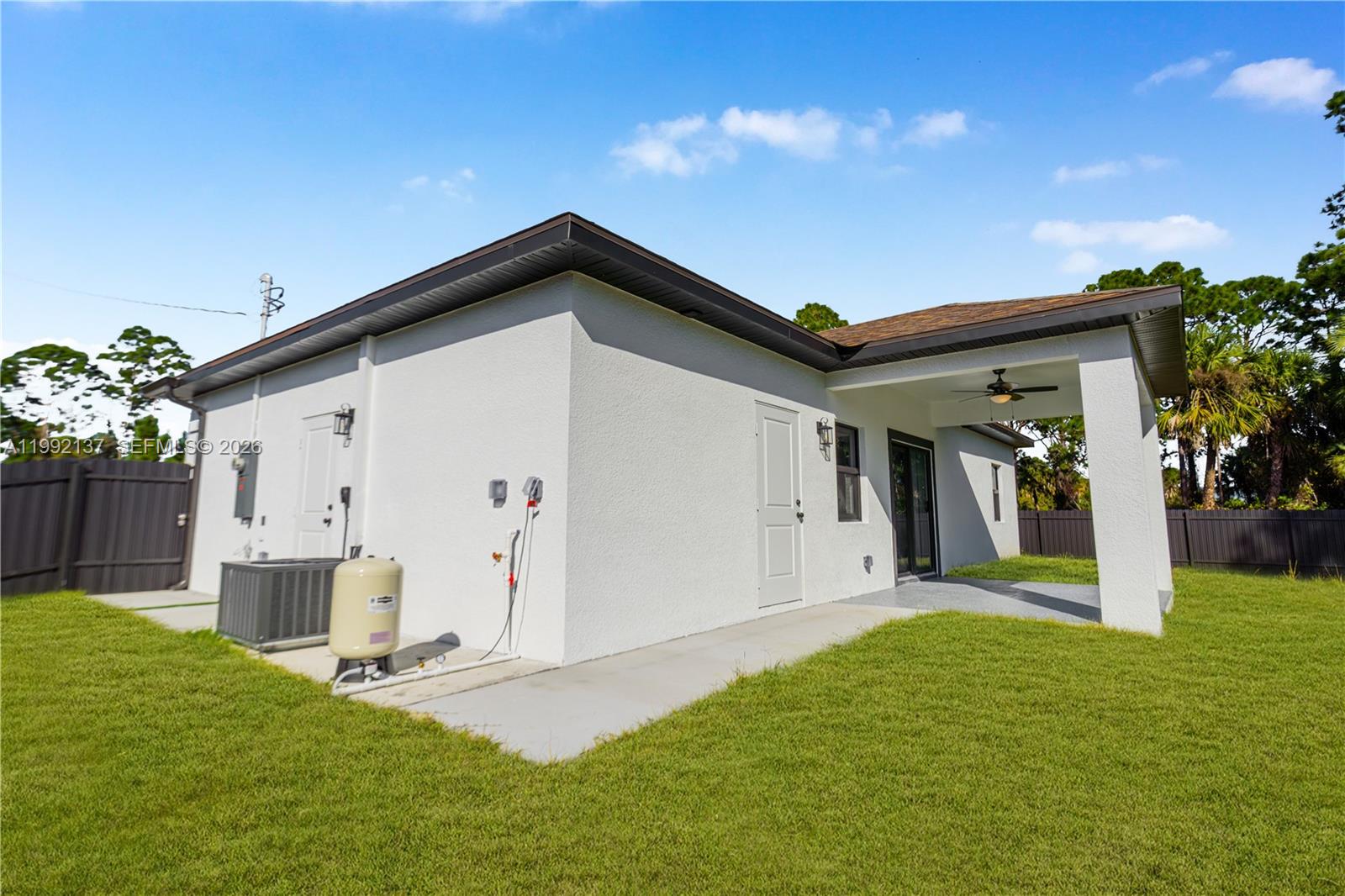 747 Roma Avenue South Lehigh Acres, FL 33974 - Photo 31 of 31 a view of a house with backyard and garden