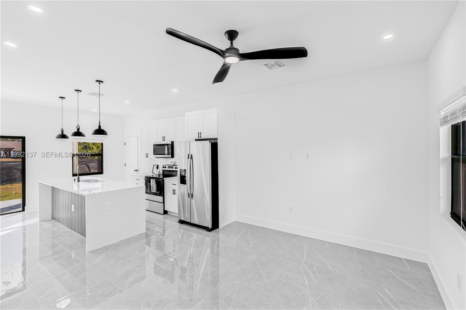 747 Roma Avenue South Lehigh Acres, FL 33974 - Photo 8 of 31 a view of kitchen and sink