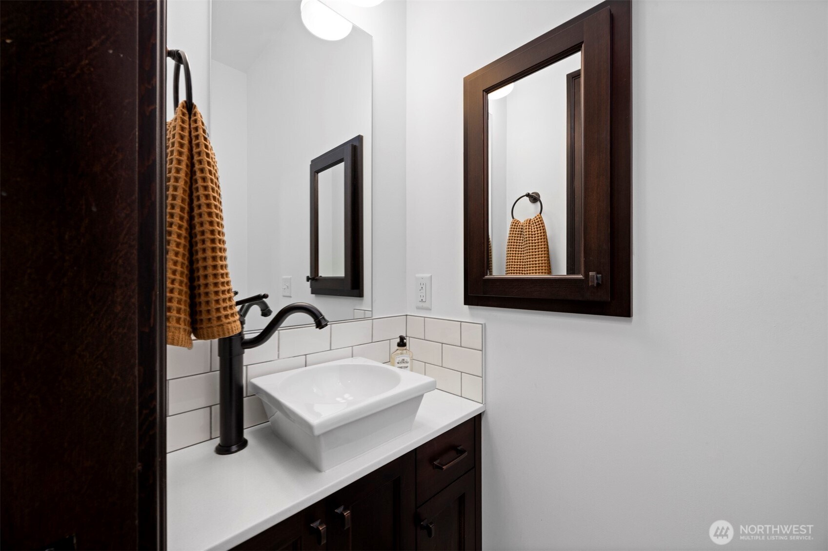 2011 Cornwall Avenue Bellingham, WA 98225 - Photo 15 of 30 a bathroom with a sink and a mirror