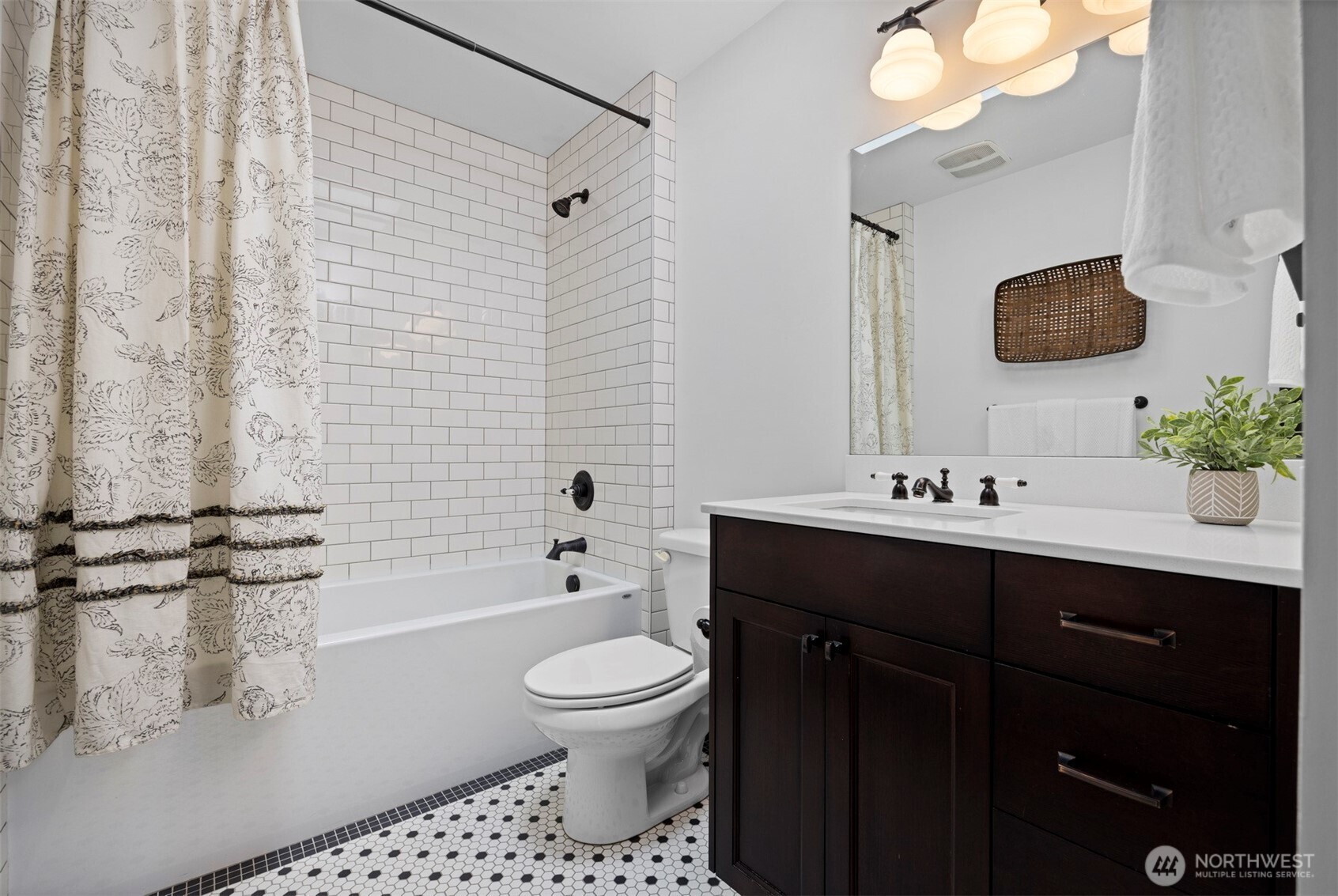 2011 Cornwall Avenue Bellingham, WA 98225 - Photo 20 of 30 a bathroom with a sink toilet a mirror and shower
