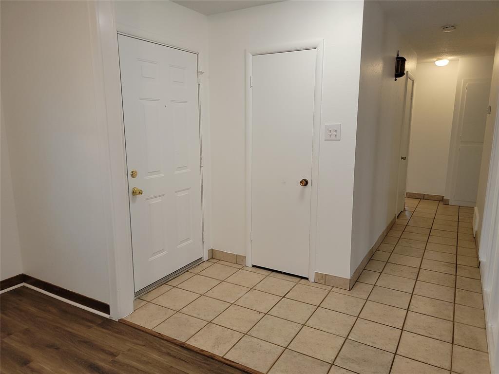 1000 Springdale Road Bedford, TX 76021 - Photo 12 of 36 Front entry leads to the bedroom hallway. Two coat closets!