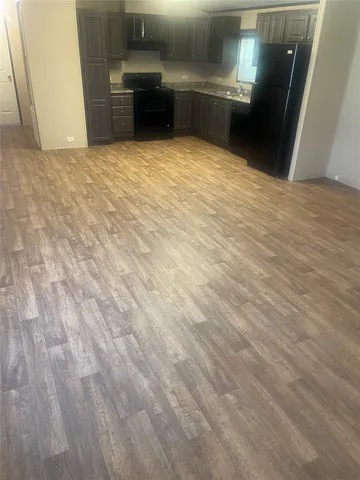 a view of a refrigerator in a kitchen