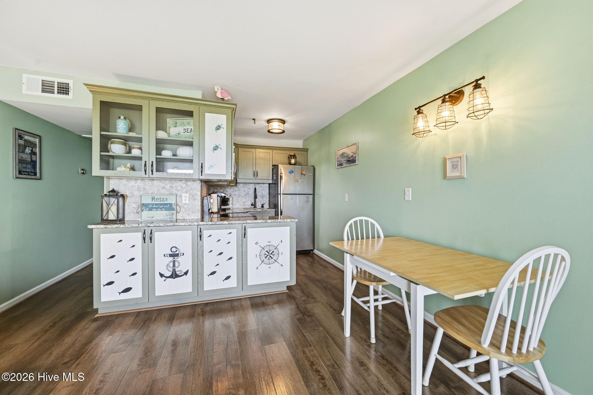 1866 New River Inlet Road, Unit 3101C North Topsail Beach, NC 28460 - Photo 9 of 30 Dining and Kitchen Area