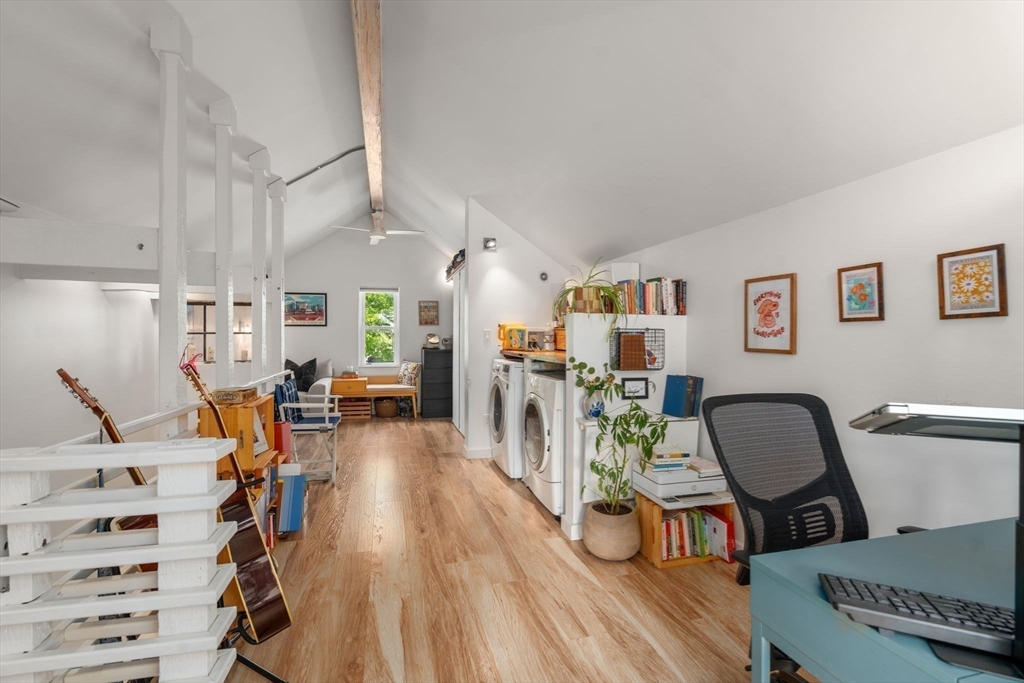 67 Dudley Street, Unit SF Boston, MA 02119 - Photo 19 of 28 a view of a room with furniture and wooden floor