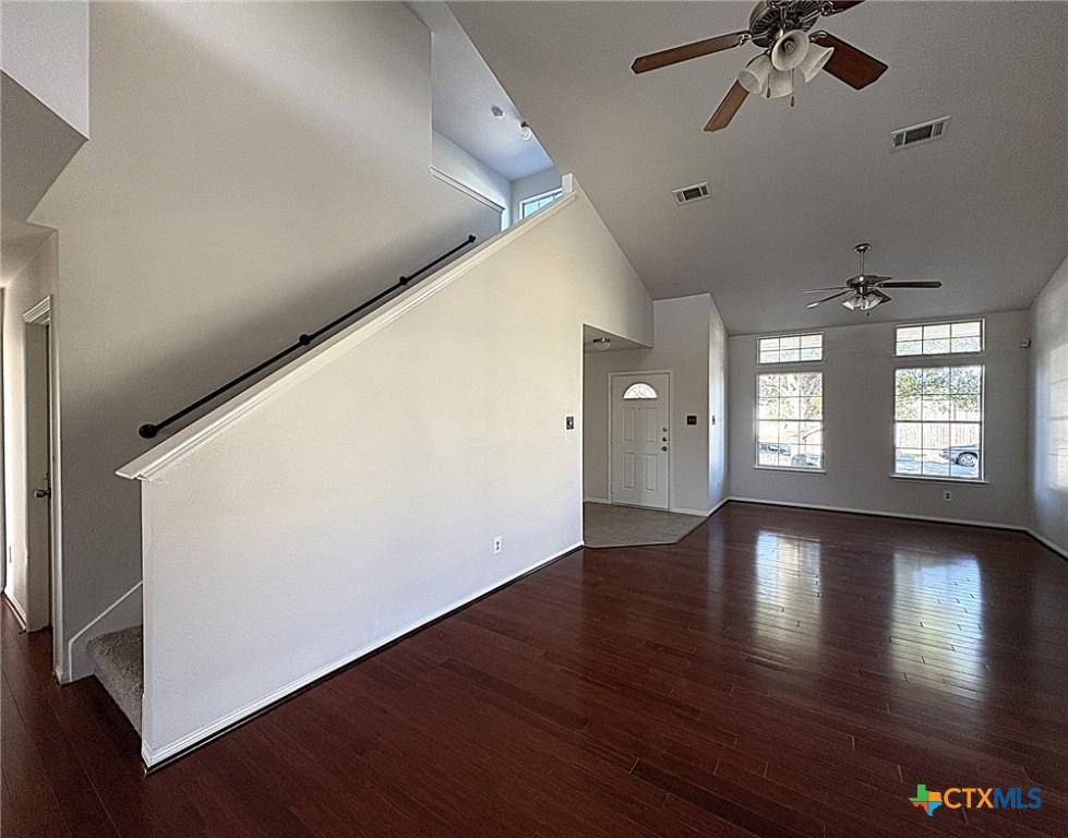 6502 Griffith Loop Killeen, TX 76549 - Photo 5 of 22 a view of an empty room with a window and wooden floor